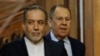 Russian Foreign Minister Sergei Lavrov (right) and Iranian Foreign Minister Abbas Araqhchi (left) arrive for a joint press conference following talks in Moscow on April 18.