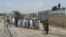 FILE: Voters queued to cast votes in Pakistani general in North Waziristan tribal district on July 25, 2018.