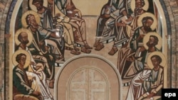 Patriarch Aleksy II (standing) at an archbishops' congress in June 