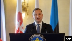Actualul președinte polonez Andrzej Duda ținând o conferință de presă la București. 4 noiembrie 2014