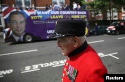 A pensioner passes in front of the U.K. Independence Party's pro-Brexit campaign bus in London.