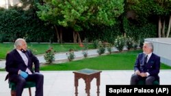 Abdullah Abdullah, right, President Ashraf Ghani's fellow leader, holds a meeting with U.S. peace envoy Zalmay Khalilzad aimed at resuscitating a U.S.-Taliban peace deal signed in February, at the presidential palace, in Kabul, on May 20.
