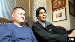 U.S. Army Captain Matt Zeller (left) with translator Janis Shenwari, whom he credits for saving his life in Afghanistan in 2008, during an interview in 2013 in Arlington, Virginia, after Shenwari received a special immigrant visa.
