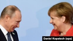 Володимир Путін і Анґела Меркель