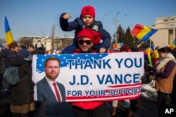 Supporters of Calin Georgescu at a rally in February