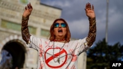 A woman wears a T-shirt bearing the word "Execution" in Persian as she takes part in a rally in Istanbul, Turkey, in November 2022.