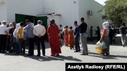 Ashgabat residents queue for food earlier this month.