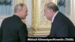 Президент РФ Володимир Путін та засновник компанії USM Holdings Алішер Усманов (зліва направо). Архівне фото 