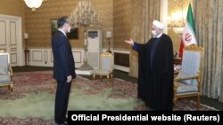 دیدار وزیر خارجه چین و حسن روحانی پس از امضای قرارداد همکاری‌های بلندمدت