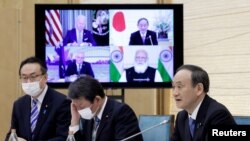Premierul Japoniei, Yoshihide Suga în timpul reuniunii online cu liderii din Statele Unite, Australia și India: președintele american Joe Biden, premierul australian Scott Morrison și premierul indian, Narendra Modi.