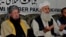 Taliban negotiators Sami-ul Haq (L) and Ibrahim Khan.