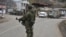 A Russian peacekeeper stands guard on a road in the town of Lachin (file photo).