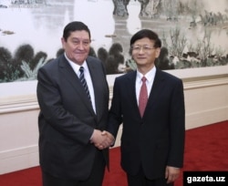 Rustam Inoyatov (left), the former head of Uzbekistan's National Security Service, during a visit to China in October 2014