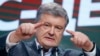 Ukrainian President Petro Poroshenko gestures while speaking at his headquarters in Kyiv after the presidential voting on March 31.