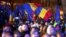ROMANIA – People wave Romanian and European Union flags during a pro-European rally ahead of the country's Dec. 8 runoff presidential elections in Bucharest, Romania, December 5, 2024 