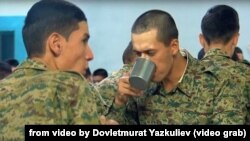 Some of the shots seem to show Omurzak Omarkuliev in staged situations, such as this one of him eating in a mess hall with other recruits.