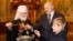 Єпископ Російської православної церкви (РПЦ), митрополит Мінський і Заславський, патріарший екзарх всієї Білорусі Павло (Пономарьов) разом із президентом Олександром Лукашенком і його сином Миколою
