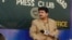 FILE: Hamid Mir recoded his television show outside the Islamabad Press Club to protest a ban by military dictator Pervez Musharraf in 2007.