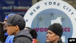 People wait to apply for jobs outside the Department of Labor in the Bronx, New York, earlier this year.