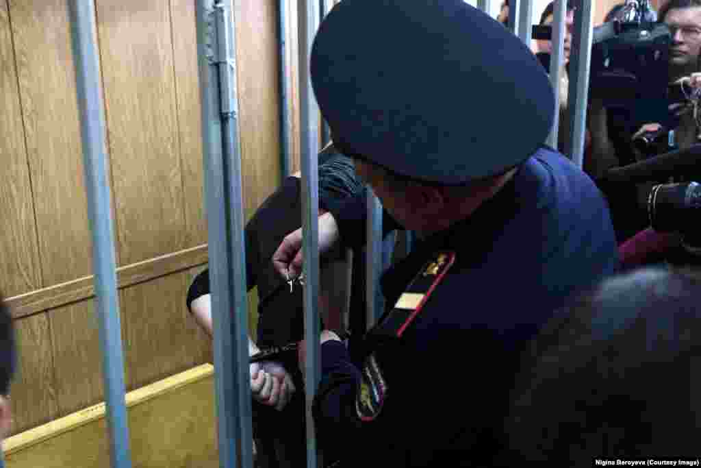 Today, seven months on from that November night, Beroyeva was squashed into a Moscow courthouse where she captured this photo of Pavlensky's handcuffs being unclicked. Soon after, he walked out a free man. Beroyeva speculates this is not the end for an artist who has confounded Russian authorities. "I won't be surprised if this performance just keeps going."