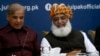 FILE: Pakistan's opposition leaders, Shehbaz Sharif (L) and Maulana Fazlur-Rehman during a meeting in Islamabad in July.