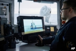 An Estonian naval ship sails in the Baltic Sea on January 9 as part of stepped-up NATO patrols in the region following the suspected sabotage of undersea cables.
