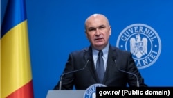 Premierul Ilie Bolojan într-o conferință de presă.