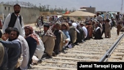 FILE: Afghan refugees wait for registration with Pakistani authorities in Quetta, Balochistan in August 2017.