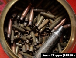Assorted bullet casings -- the raw material for his work -- waiting in Tadevosian’s workshop
