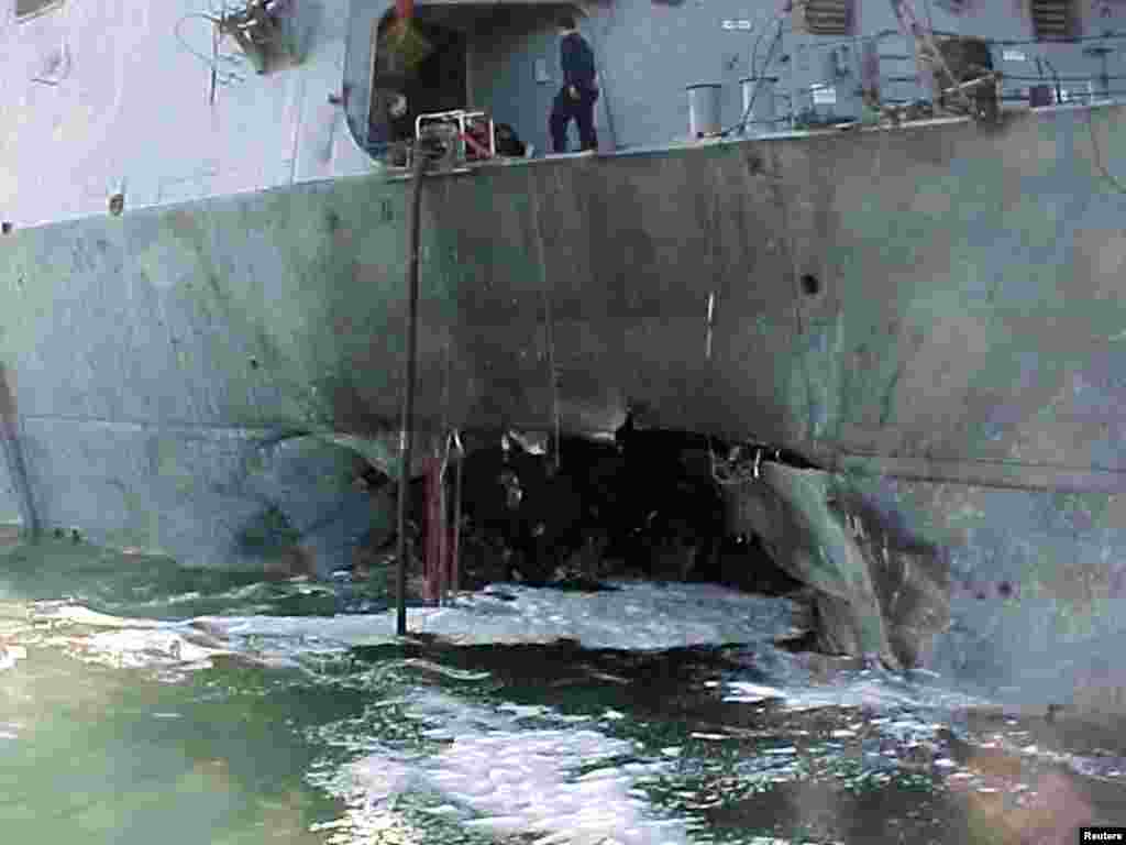 The "USS Cole" is pictured after a bomb attack during a refueling operation in the Yemeni port of Aden in this October 12, 2000, photo. Seventeen U.S. service members were killed in the attack.