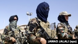 Afghan soldiers secure the scene of an attack allegedly carried out by the Islamic State militants in the capital Kabul in July.