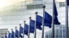 EU flags in front of European Commission in Brussels - generic