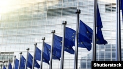EU flags in front of European Commission in Brussels - generic