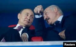 Putin with Lukashenka at the closing ceremony of the European Games in Minsk in June.
