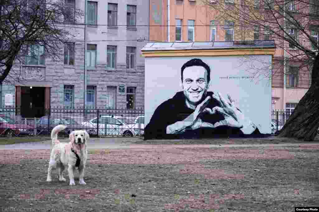 The mural depicted Navalny making the heart gesture to his wife from a glass defendants' cage in a Moscow courtroom in early February after he was sentenced and taken away to a Russian prison for 2 1/2 years.