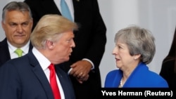 Președintele Donald Trump și premierul britanic Theresa May, miercuri la Bruxelles