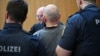 Defendant Dieter S. is escorted at court, in Munich, Germany, May 20, 2025