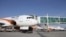 FILE: An Afghan Kam Air passenger jet is parked at Kabul International Airport.