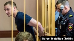 Maksim Yablokov (left) is shown at a court hearing in Yaroslavl on July 25, 2018.