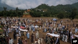 Flooding in a northwest Pakistani district has killed at least 340 people, officials said on Sunday, as rescuers pulled 54 more bodies overnight from homes flattened by flash floods and landslides.