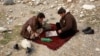 Afghanistan -- Men play chess in Kabul January 13, 2014.