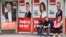 People wait at a bus stop draped in election posters in the Bosnia capital, Sarajevo, late last month. 