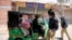 Police officers forcing a rickshaw driver to stop working during a nation-wide lockdown to curb the spread of the coronavirus in the southern city of Hyderabad in Sindh Province on April 3.