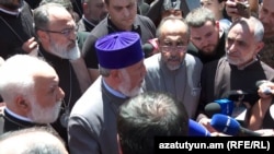 Armenia - Catholicos Garegin II and Archbishop Mikael Ajapahian talk to journalists during a standoff with security forces, Echmiadzin, June 27, 2026.