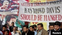 Supporters of the political party Tehreek-e Insaf take part in a protest against Raymond Davis in Lahore on February 17.