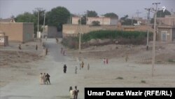 The main street in the impoverished village of Shah Hassan Khel