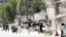 FILE: Afghan Security forces at the site of a suicide attack in Kabul on April 30.