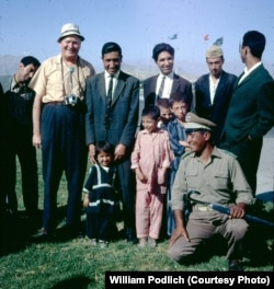 Of her father, Dr. William Podlich (second from left), Peg Podlich said: "He had always said that since he had served in WWII...he wanted to serve in the cause of peace. In 1967, he was hired by UNESCO as an expert on principles of education for a two-year stint in Kabul.... Throughout his adult life, because he was interested in social studies, whenever he traveled around [in Arizona, to Mexico, and other places] he continued to take pictures. In Afghanistan he took half-frame color slides [on Kodachrome] and I believe he used a small Olympus camera."