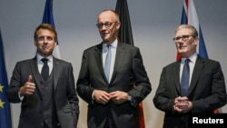 French President Emmanuel Macron, Germany's Chancellor Friedrich Merz, and Britain's Prime Minister Keir Starmer pose for the media at a hotel prior to an E3 meeting on the sidelines of the NATO summit in The Hague, Netherlands, June 24, 2025.