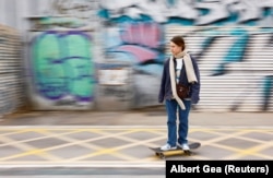 Ukrainian refugee Viktoria Blinova rides a skateboard in Barcelona.
